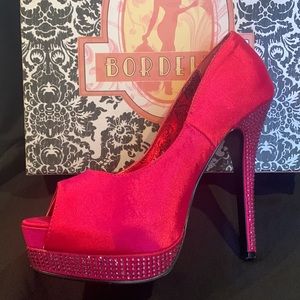 Bordello satin peep toe pumps.